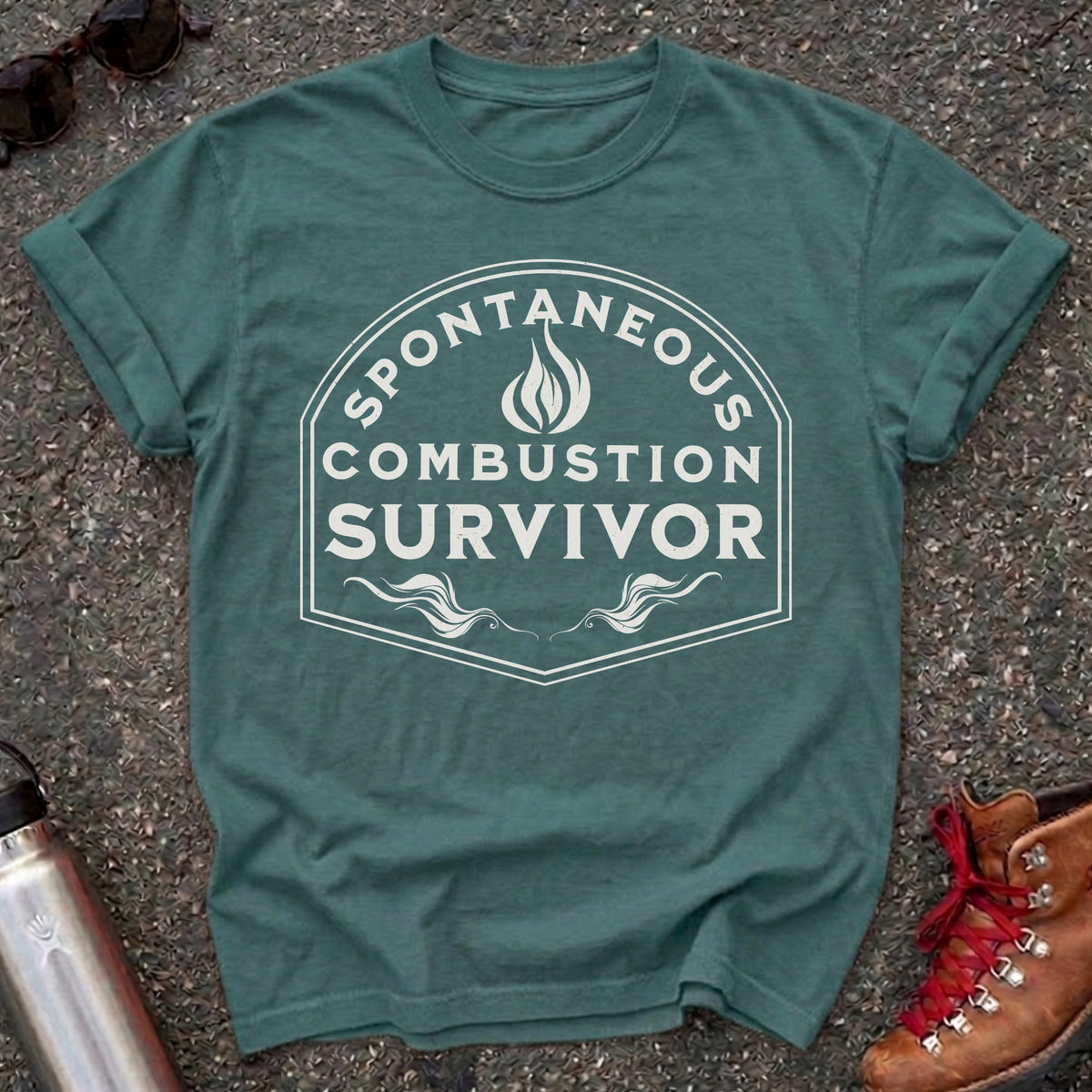 Comfort Colors t-shirt with a vintage flame badge reading Spontaneous Combustion Survivor