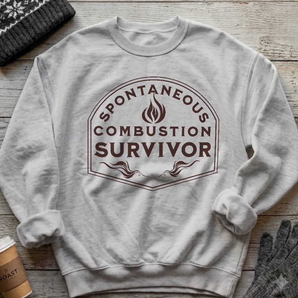 Crewneck sweatshirt with a vintage flame badge reading Spontaneous Combustion Survivor
