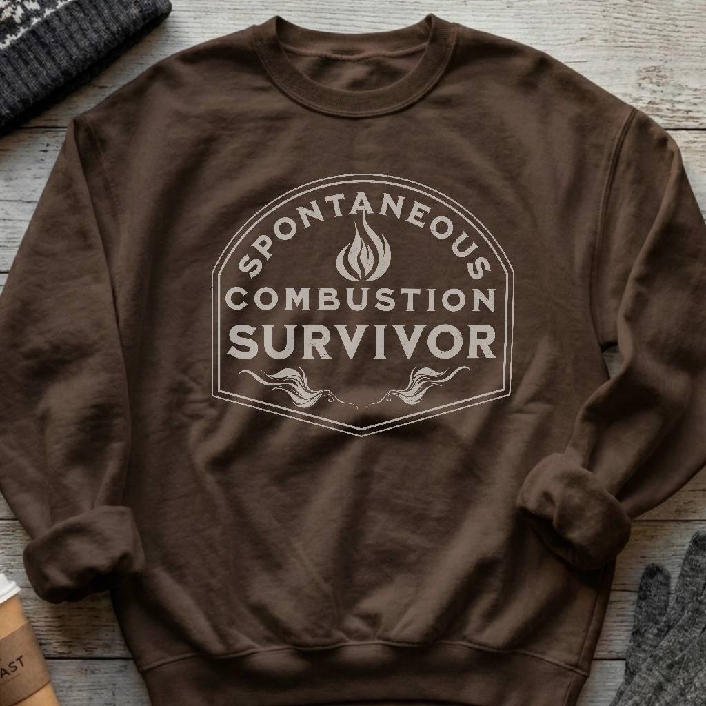 Crewneck sweatshirt with a vintage flame badge reading Spontaneous Combustion Survivor