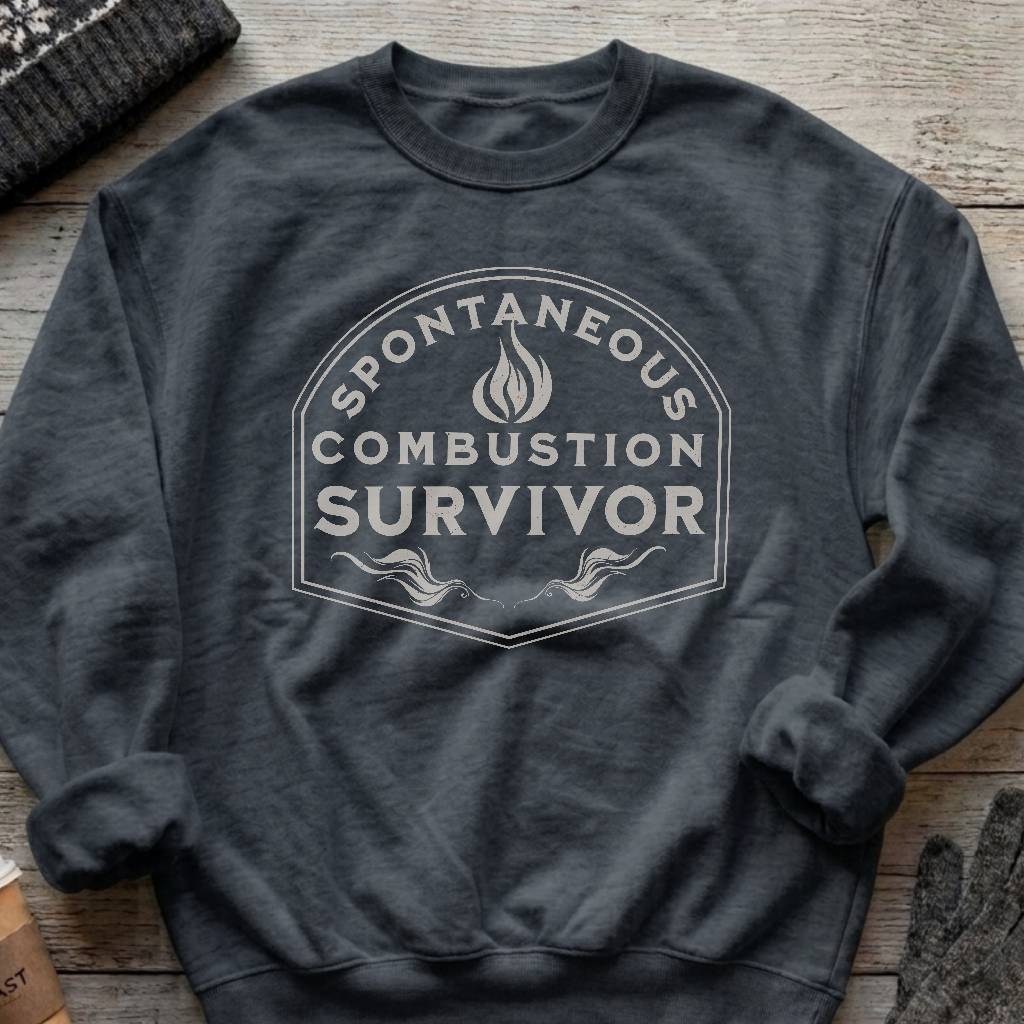 Crewneck sweatshirt with a vintage flame badge reading Spontaneous Combustion Survivor