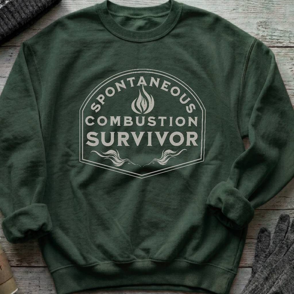 Crewneck sweatshirt with a vintage flame badge reading Spontaneous Combustion Survivor