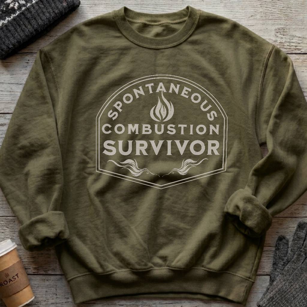 Crewneck sweatshirt with a vintage flame badge reading Spontaneous Combustion Survivor