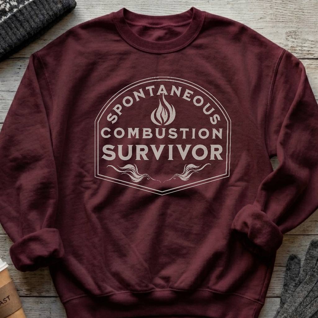 Crewneck sweatshirt with a vintage flame badge reading Spontaneous Combustion Survivor