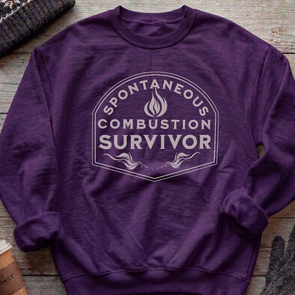Crewneck sweatshirt with a vintage flame badge reading Spontaneous Combustion Survivor