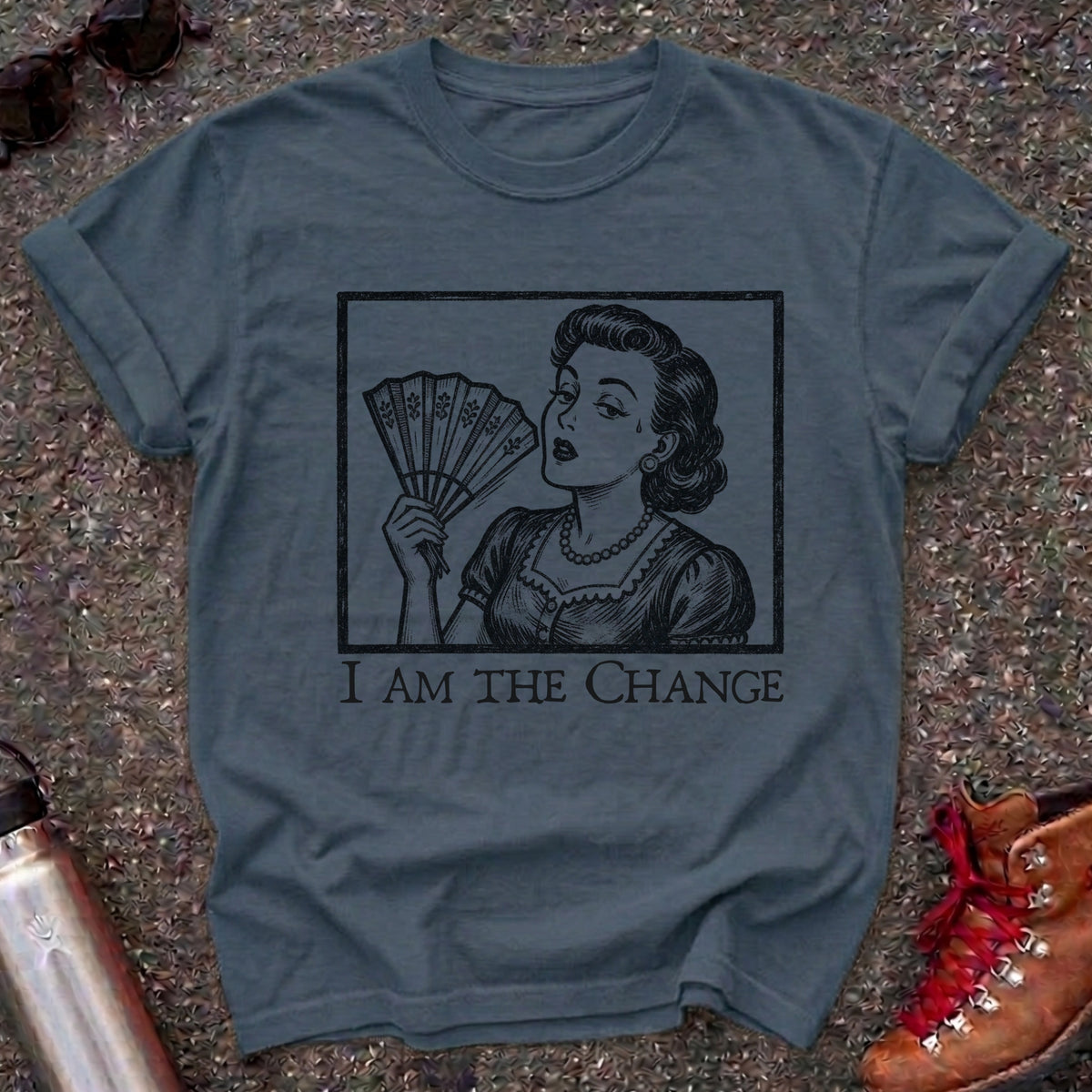 Comfort Colors t-shirt with a retro 1950s woman fanning herself in vintage woodcut style and the words I Am the Change