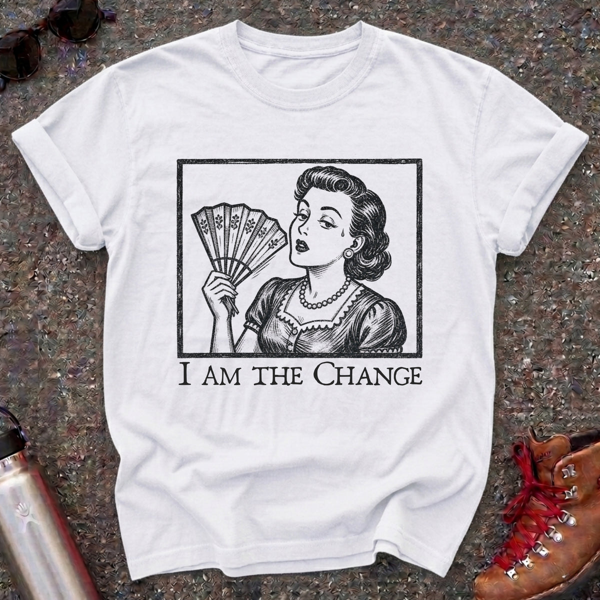 Comfort Colors t-shirt with a retro 1950s woman fanning herself in vintage woodcut style and the words I Am the Change
